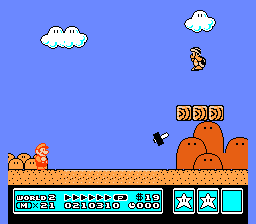 [Image of Mario in a desert Hammer Brothers level, featuring a quicksand pit]