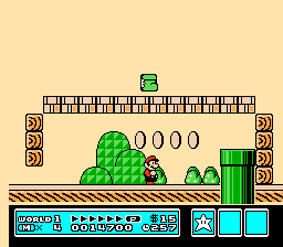 [Image of Mario beneath a platform, with a Goomba inside Kuribo’s Shoe above him]